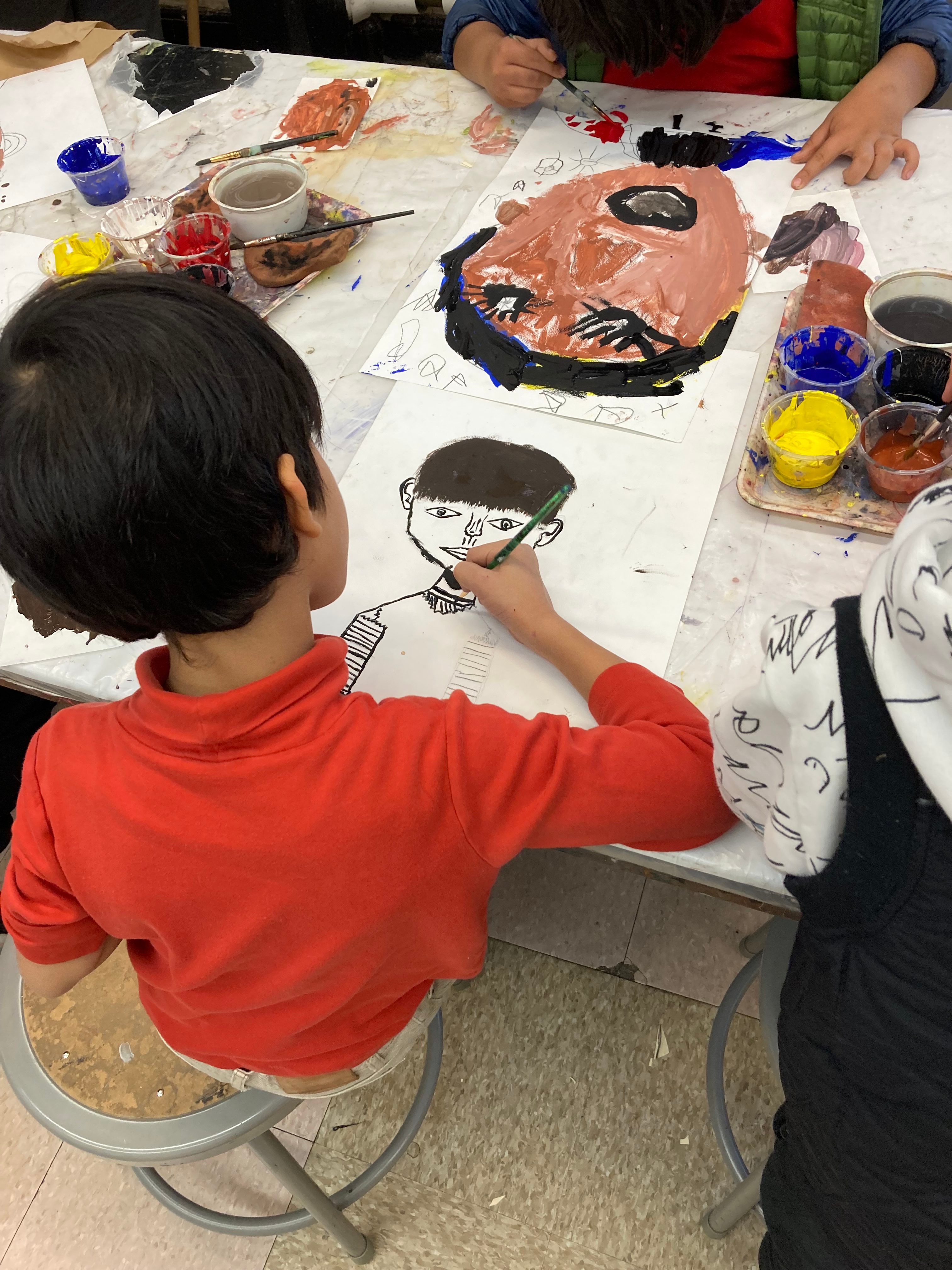 Child painting self-portrait