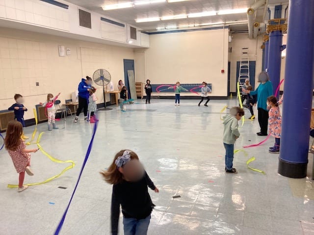 Students dancing with ribbons